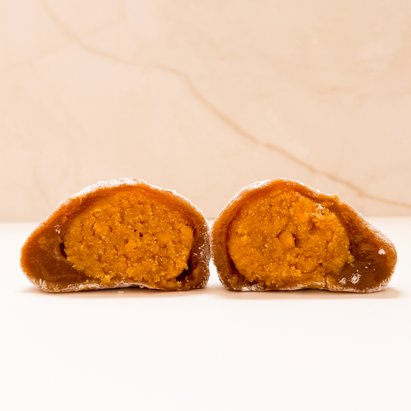 Mango Mookie cut open to reveal mango cookie dough filling